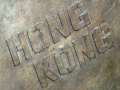 The words ‘Hong Kong’ inscribed on a crate