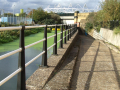 Path along the river with Olympic stadium in the background 