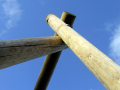 Looking up at the frame of a swing