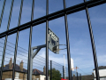 Basketball net through fence