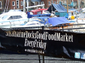 Food market banner on railings