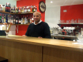 The friendly manager at the bar	