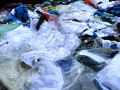 Clothing in plastic wrappers