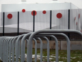 Stadium behind bike rack 