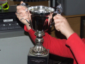 Holding a football trophy