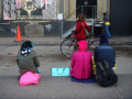 people sitting in street