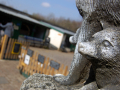 Base of statue with farm behind