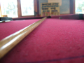 Pool table with snooker cue