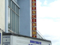 front of cinema with what's showing