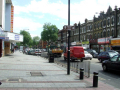 street in front of cinema showing local shops