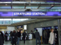 people walking in and out of Stratford Station