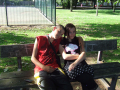 couple sitting on park bench