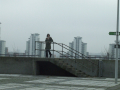 Woman looking out over river	