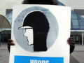 'hoods must be worn in this area' sign