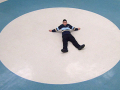 boy laying in a circle on the floor