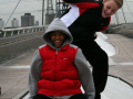 friends playing on footbridge