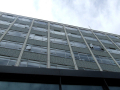 Looking up at the front of the building, lots of windows