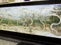 Painting of eels swimming in reeds