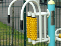 Outdoor gym equipment with curved handles