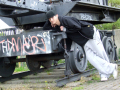 boy leaning against railway truck
