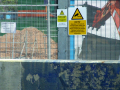 Signs of building behind railings