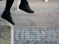 Girl jumping off post	