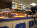 man ordering chips while talking to the owners