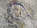Figure graffitied on concrete